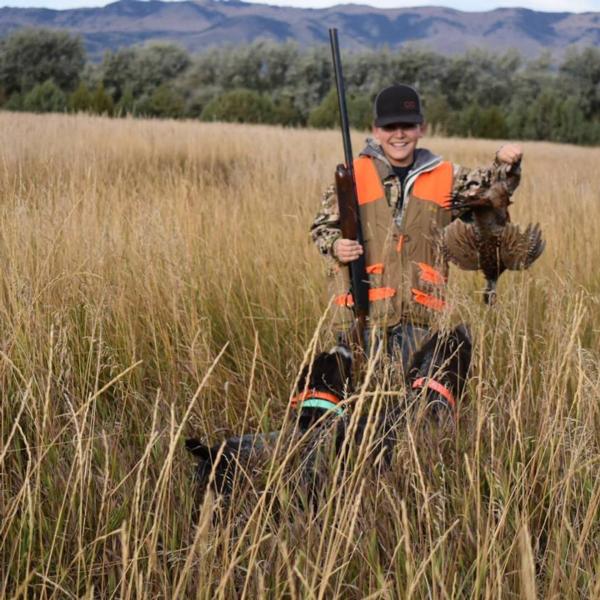 Kaeben Bushnell holds a harvested rooster at the 2018 youth hunt.  